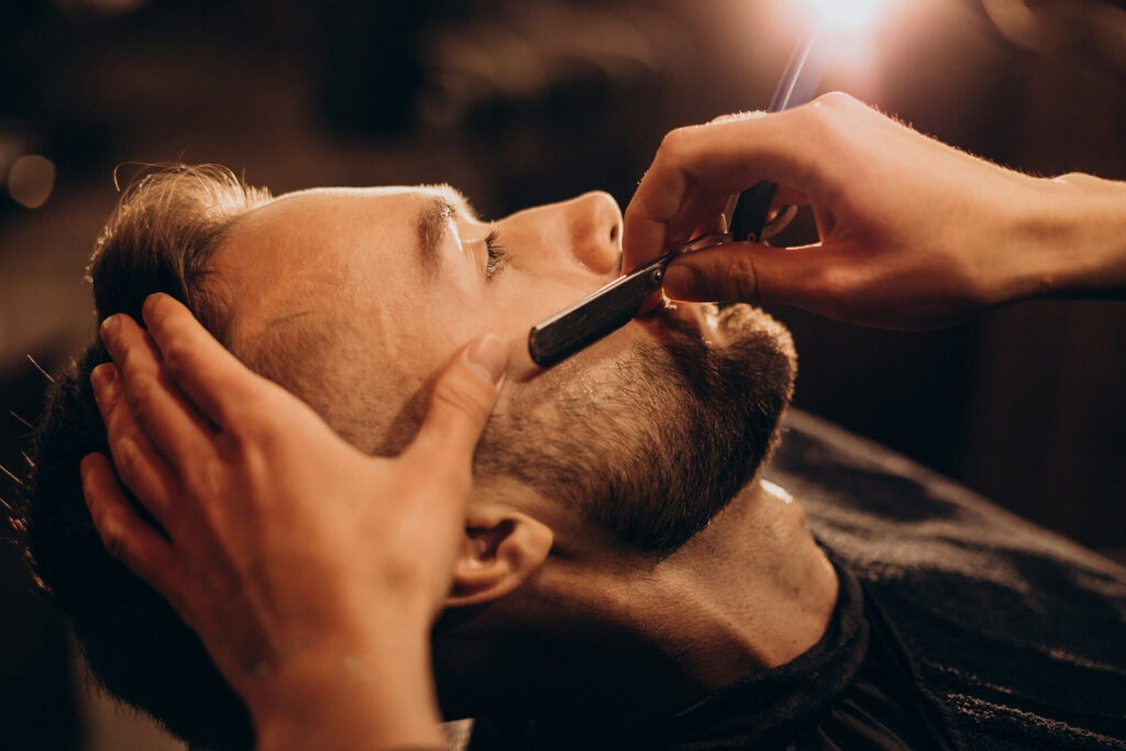 A barber giving a beard trim